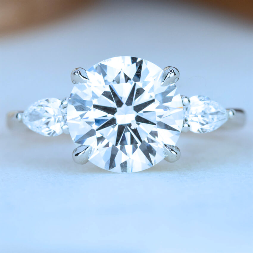 Round Brilliant Cut Diamond Ring With Pear Shape Side Diamonds - Australian Diamond Network